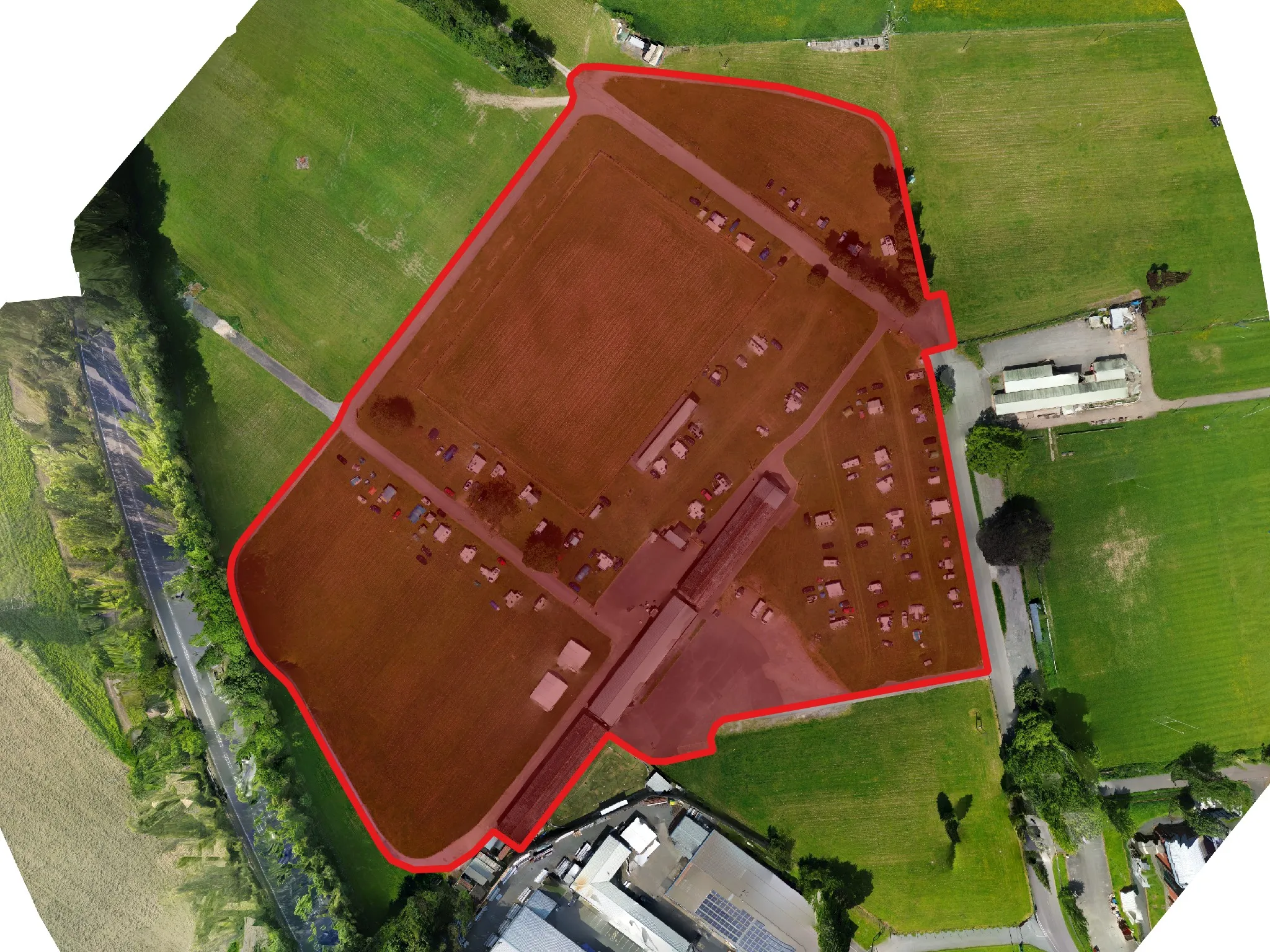 An example of boundary outlining, showing the outline of the event area at a showground with a red line and a light red fill inside the boundary